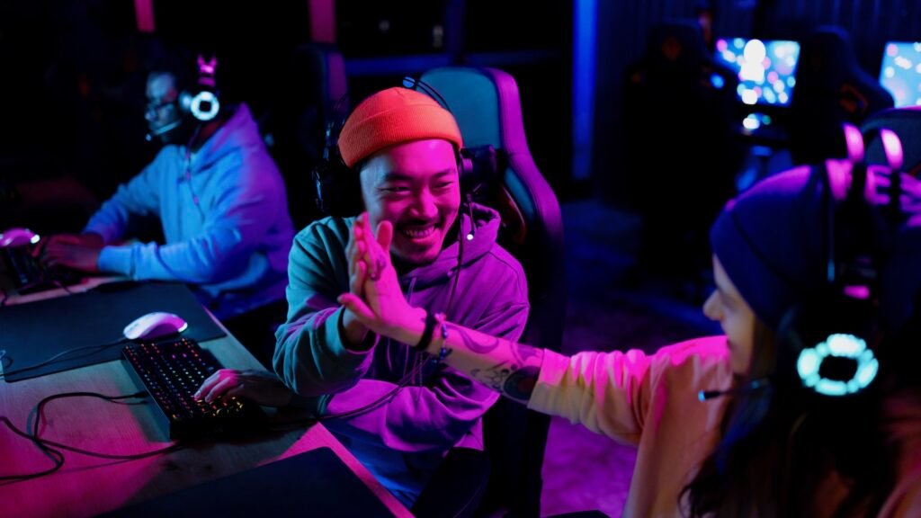 A young man is congratulating his friend on winning in esports.