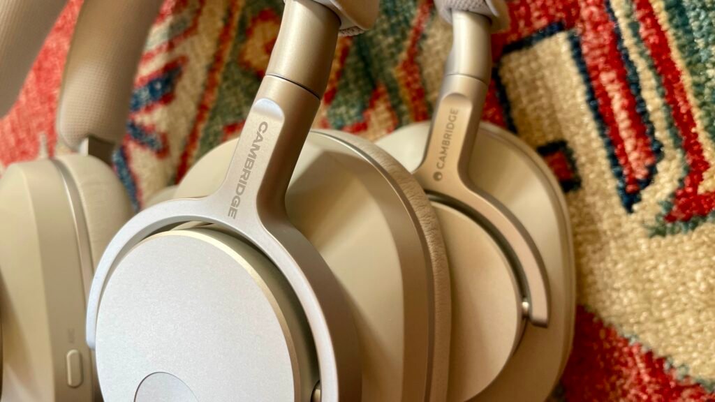 Cambridge Audio Melomania P100 with the original P100, either worn by Becky Scarrott or next to each other, to illustrate the similarities