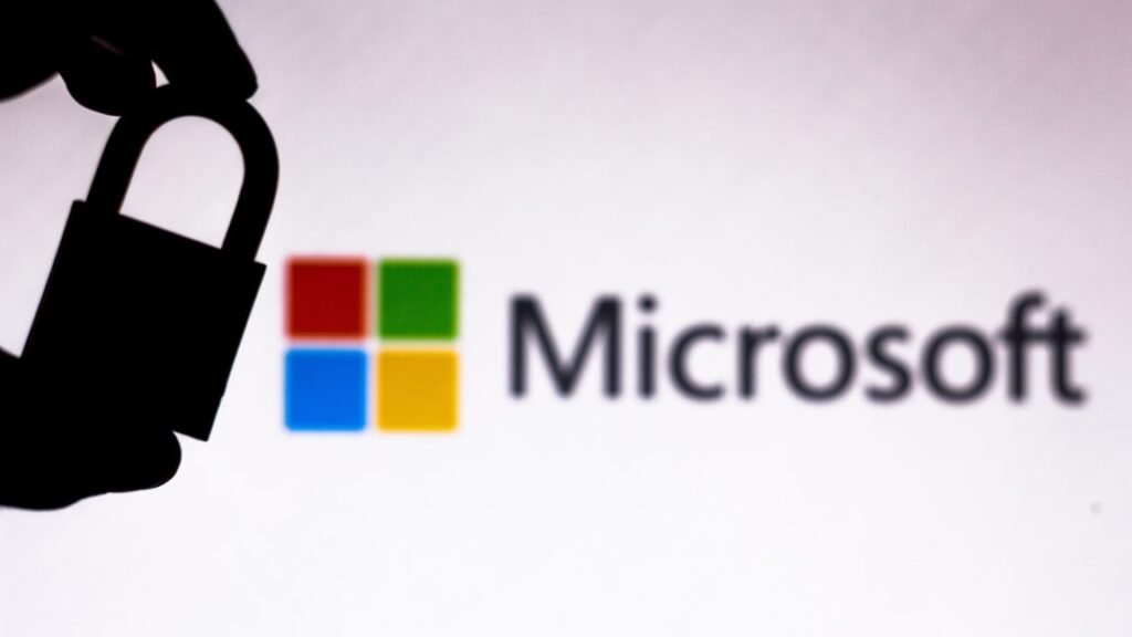 In this photo illustration a padlock appears next to the Microsoft Corporation logo