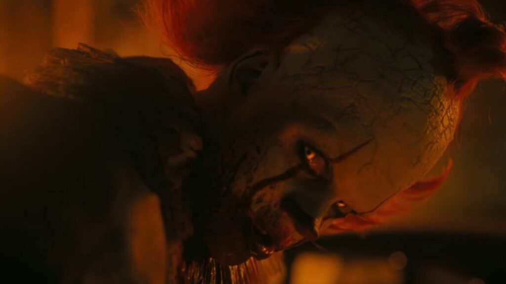 closeup of sinister clown giving an evil smile to the camera