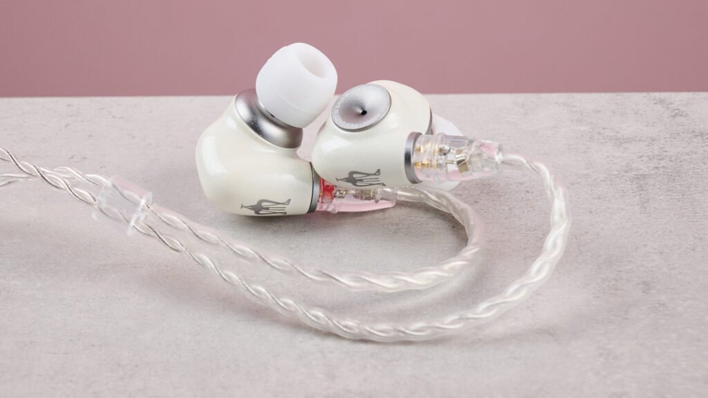 Want to get into audiophile-grade sound? I’d start with these excellent yet affordable wired earbuds Meze Alba IEMs on a table against a pink background