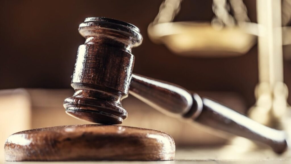 Judge orders stop to FBI search of devices seized from Washington Post reporter A judge's gavel with scales in the background.