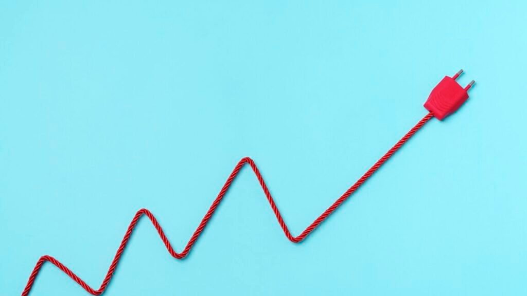 Why I’m withholding certainty that “precise” US cyber-op disrupted Venezuelan electricity Red Electric Power Plug Adn cable forming a chart on blue background. Increase to electricity prices concept.