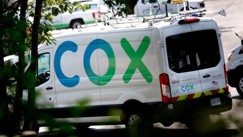 Charter gets FCC permission to buy Cox and become largest ISP in the US A cable service van with a large Cox logo painted on its side.