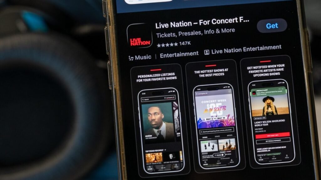 The Live Nation app displayed in an app store on a smartphone. A pair of headphones is shown next to the smartphone.