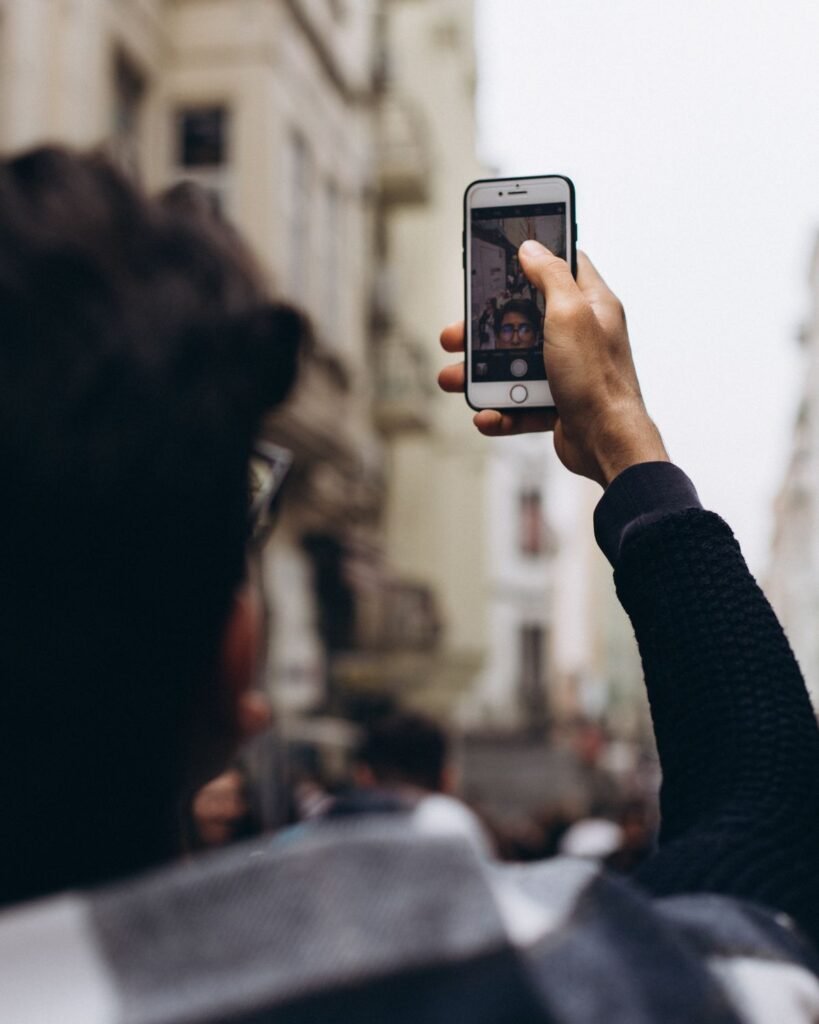 Person taking a selfie with a smartphone