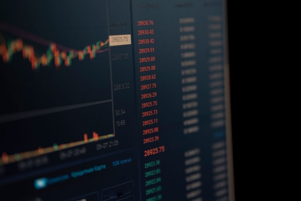 How to Interpret Candlestick Patterns (Not Just Name Them) Trader working to interpret candlestick patterns on a market chart displayed on a monitor