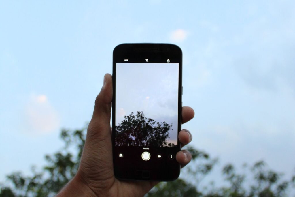 Person taking a photo with a phone camera