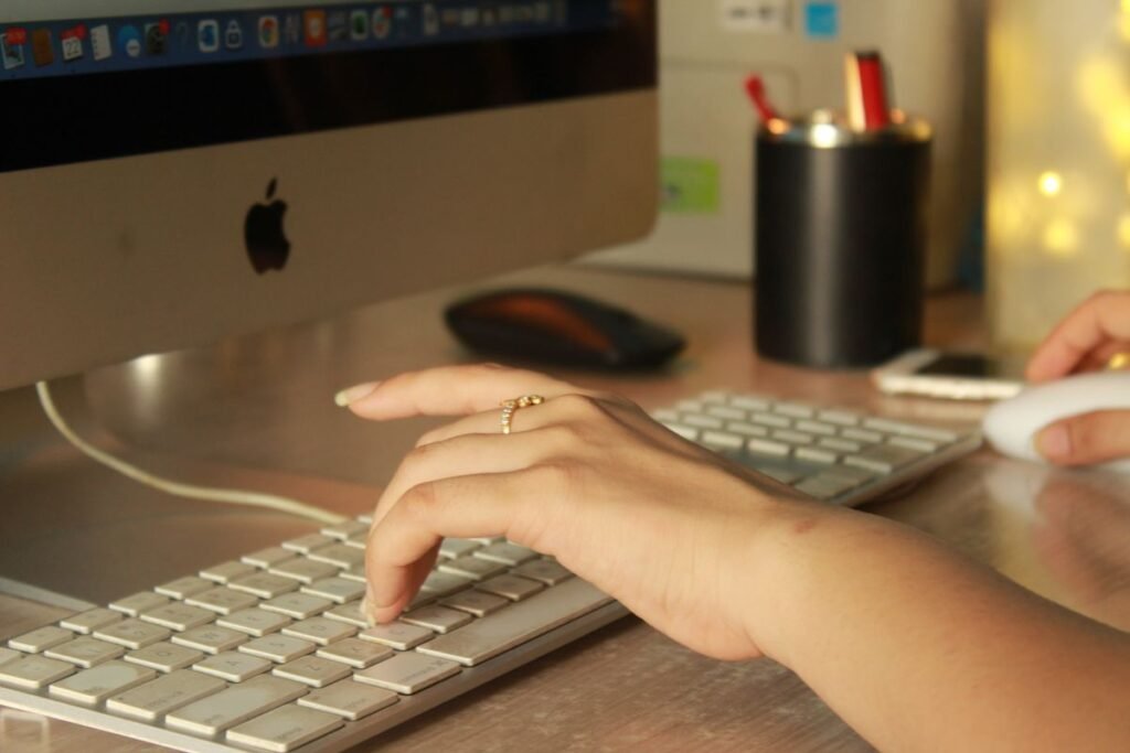 Free Typing Practice for Beginners Close-up of woman hands typing on a computer keyboard