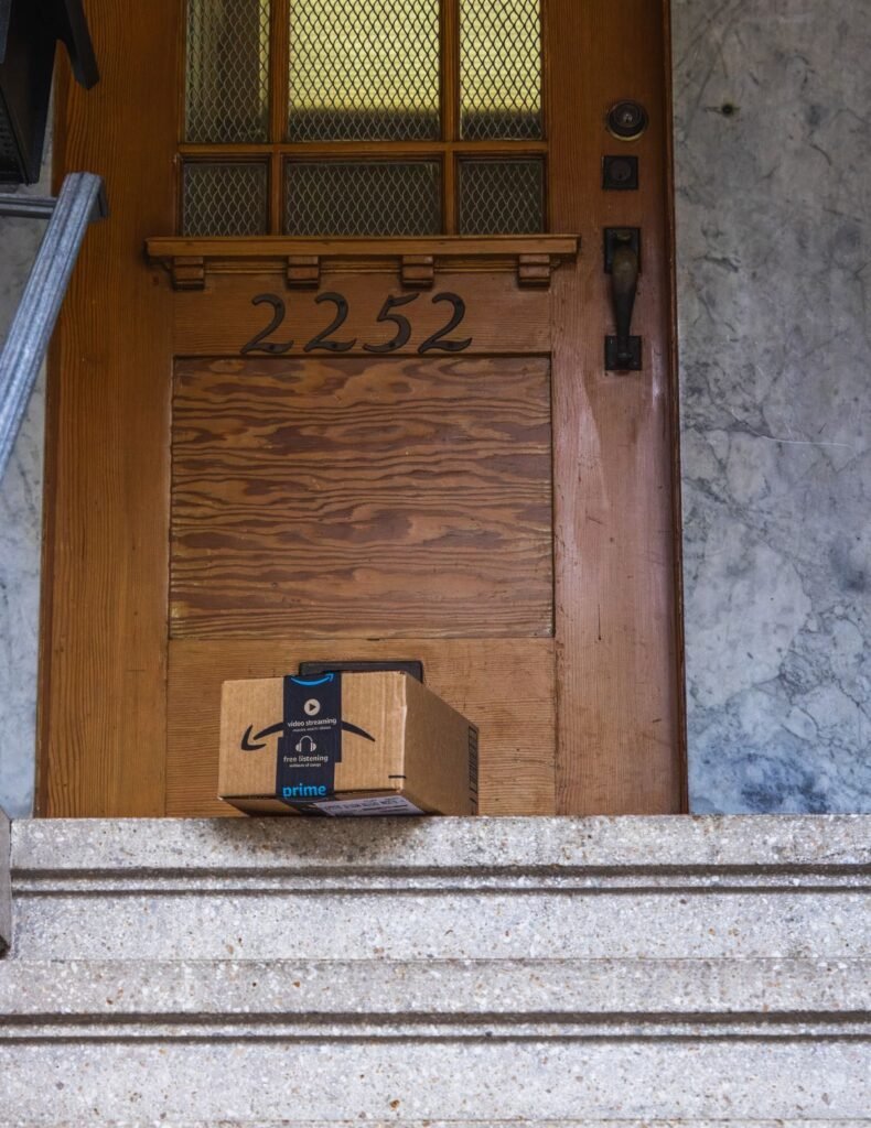 Amazon cardboard package delivered at a front door