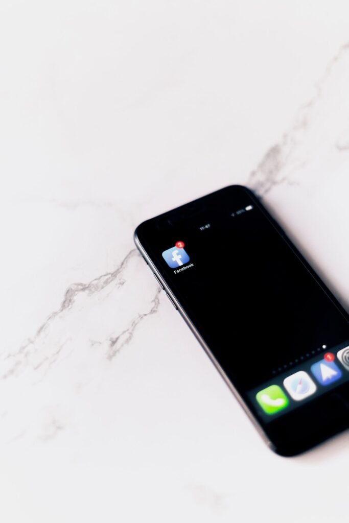Facebook app open on a phone, illustrating how to post content on a user's Facebook timeline