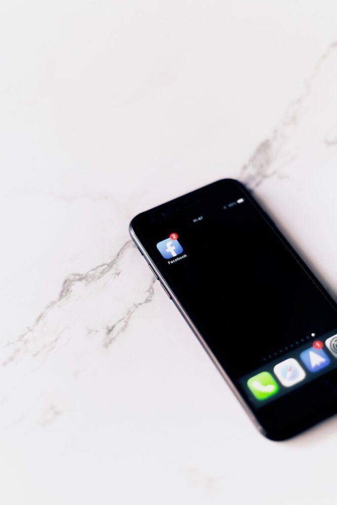 A smartphone home screen displaying the Facebook app icon