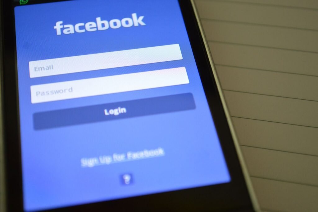 Phone showing social apps, illustrating how to hide friends on Facebook