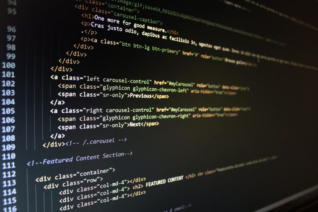 Monitor showing website code and layout while you create a Joomla website