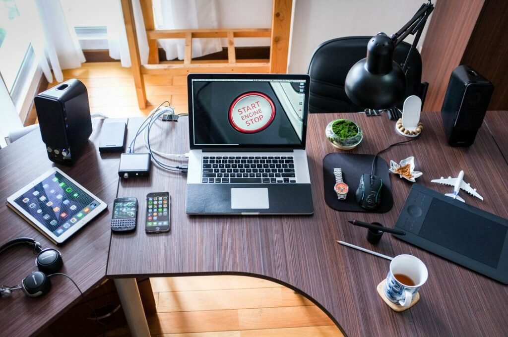 Laptop computer on a wooden desk with a clean desktop