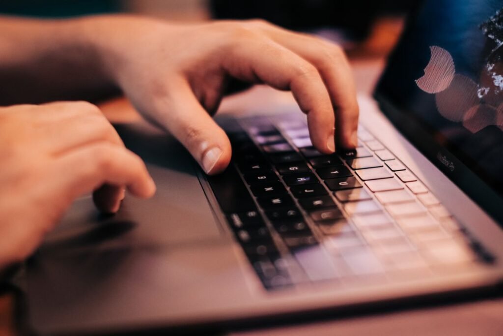 Person using a laptop running Windows on a desk