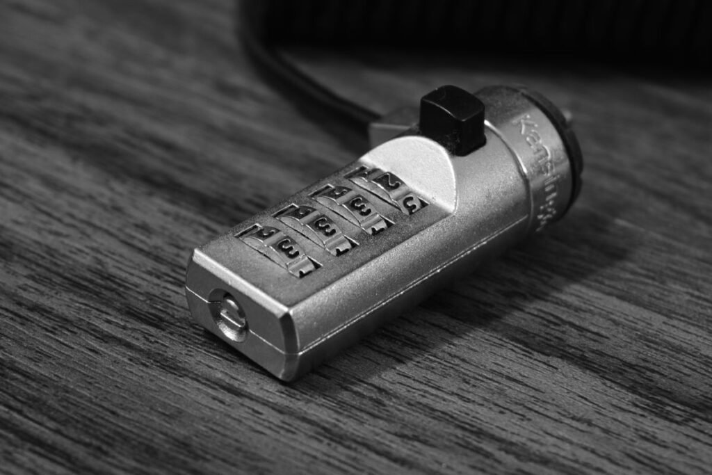 Laptop computer secured with a padlock representing a locked meeting