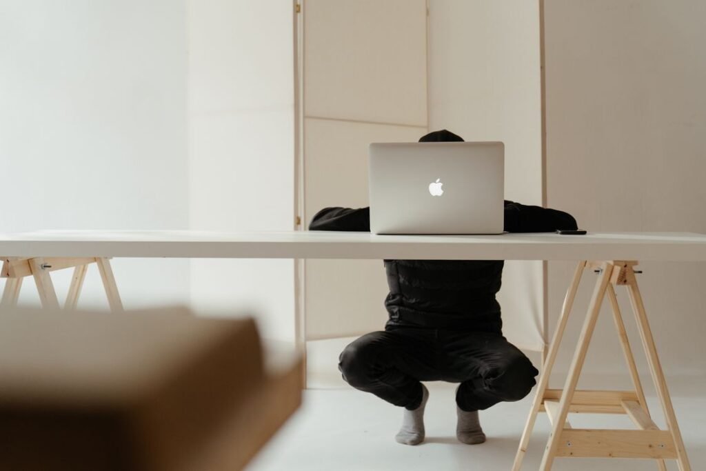A laptop open on a clean white table