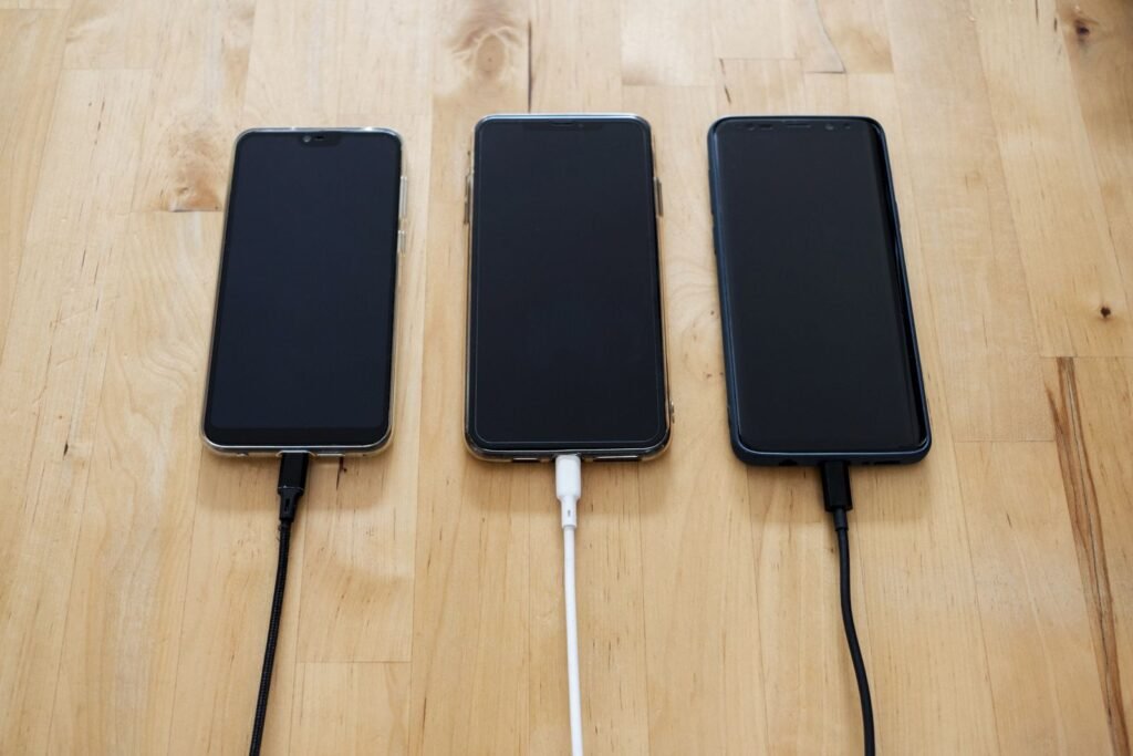 Smartphone plugged into a charging cable