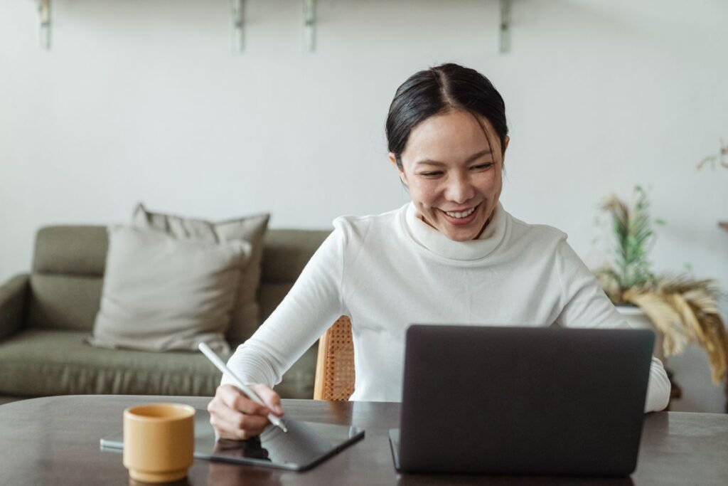 Woman working at home and making a video call on a laptop