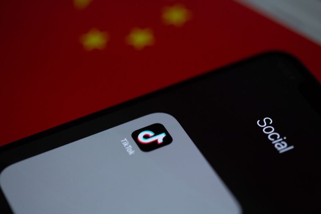 Close-up shot of the TikTok app open on a phone