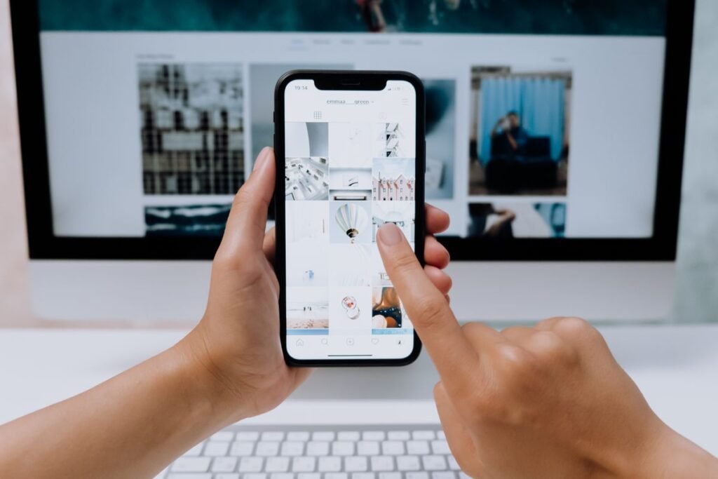How to Use Snapchat: A Complete Beginner’s Guide Hands holding a smartphone browsing a social media app