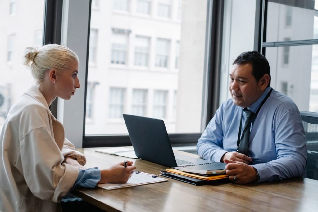 Two people in a technical interview discussing how to explain your coding solution in an interview