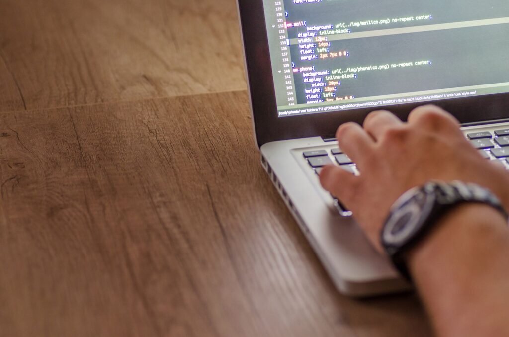 How to Sell WordPress Plugins: A Developer’s Guide for 2026 Developer writing WordPress plugin code on a laptop before launching it as a paid product