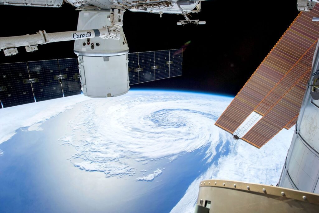 Solar-powered satellite in orbit above Earth, illustrating the concept of orbital AI data centers