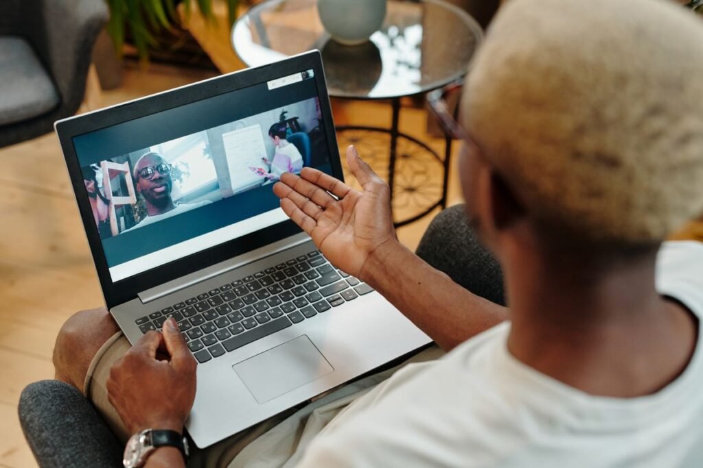 Man speaking on a video call, spotlighted as the main speaker