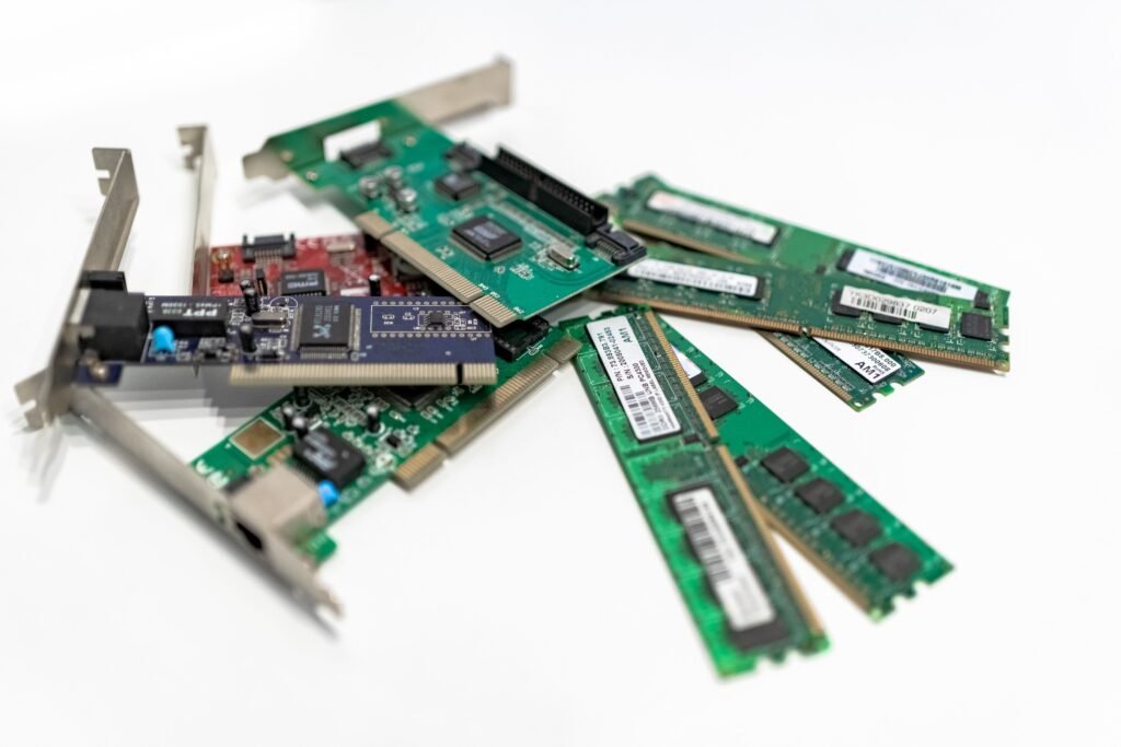 AI Is Eating the World’s Memory Chips, and Your Next Gadget Is Paying the Price Close-up of computer RAM memory modules, illustrating the 2026 AI-driven DRAM and NAND chip shortage