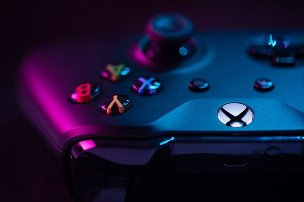 Close-up of a video game controller with its analog sticks and buttons in view
