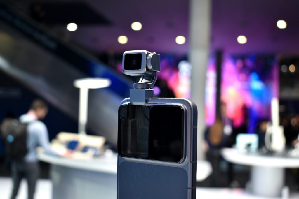 Honor Built a Phone With a Robot Arm. The Catch Is You Cannot Buy It. A gimbal stabilizer holding a smartphone, representing the motorized gimbal camera built into the Honor Robot Phone