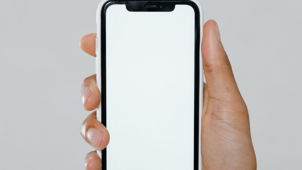 A hand holding an iPhone, illustrating Apple's expected September 9 iPhone 18 Pro and foldable iPhone Ultra launch event