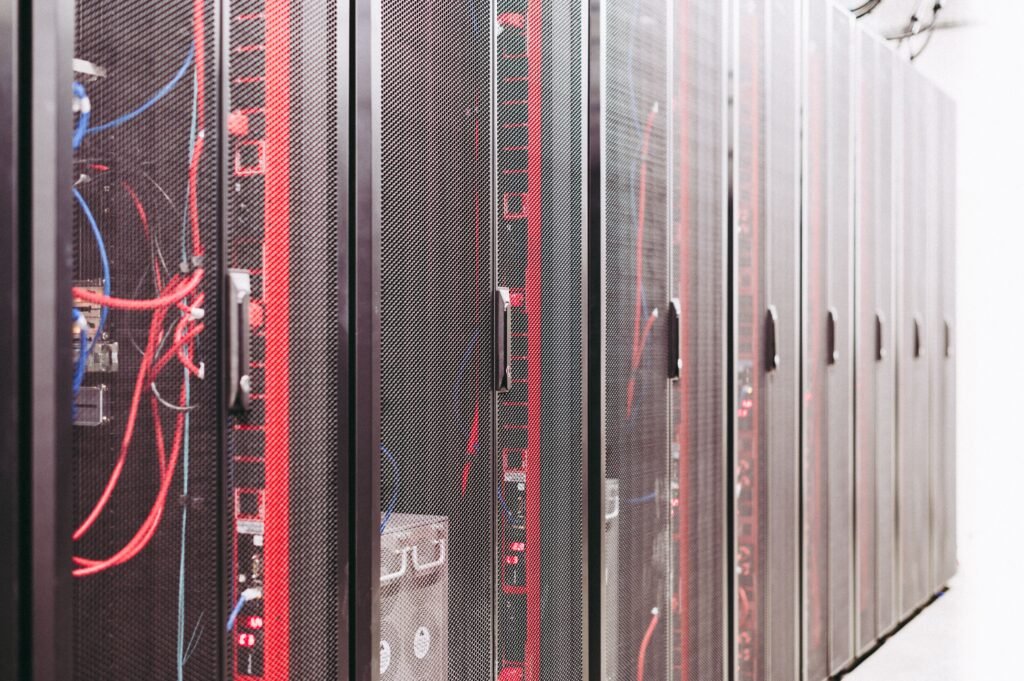 A Poisoned Security Scanner Just Leaked 153GB of Secrets From 2,488 Companies Rows of server racks and network cables in a data center, illustrating the LiteLLM supply chain attack on CI/CD pipelines