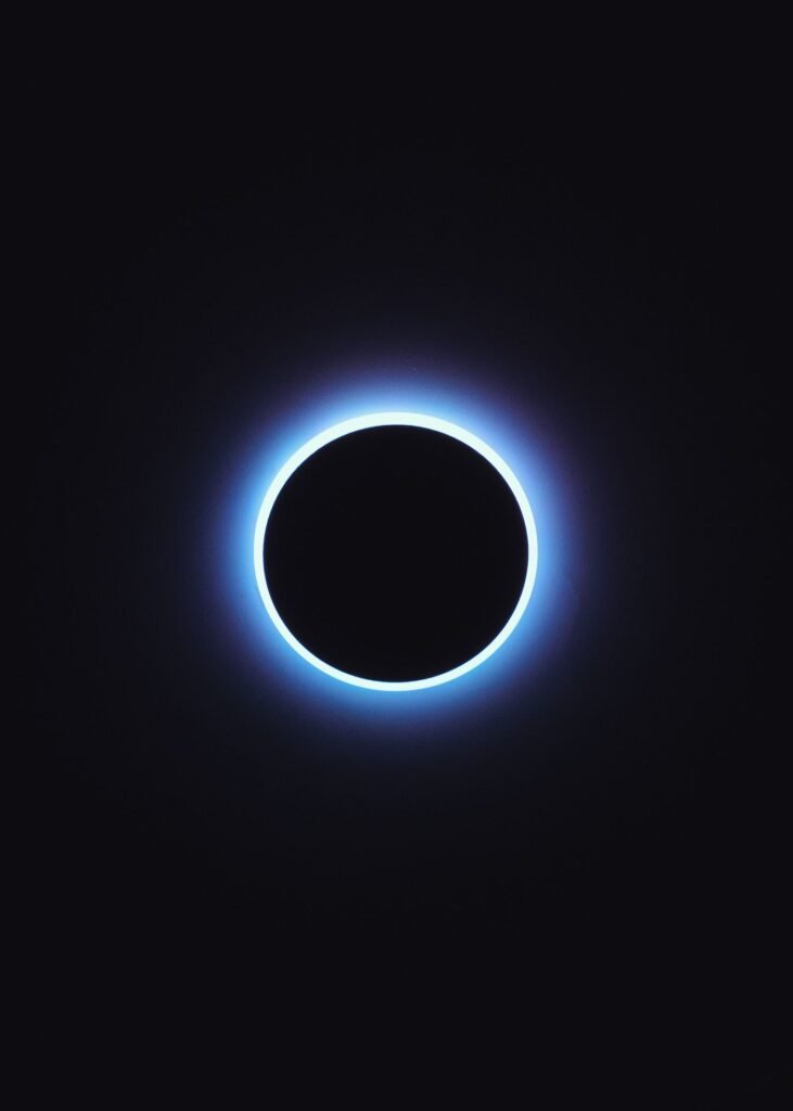Total solar eclipse showing the sun's corona in a dark sky, the real astronomical event behind the Project Anchor gravity hoax