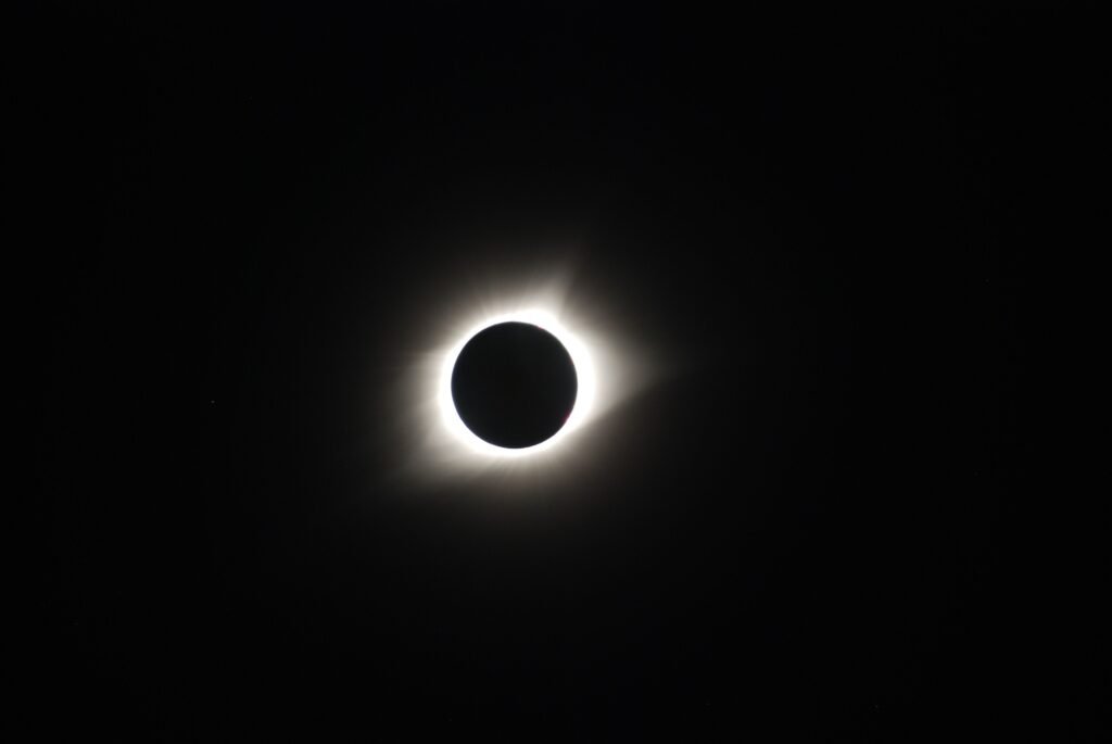 NASA Says Pointing Your Phone at the August 12 Eclipse Can Permanently Wreck the Camera Total solar eclipse showing the sun's corona in a dark sky