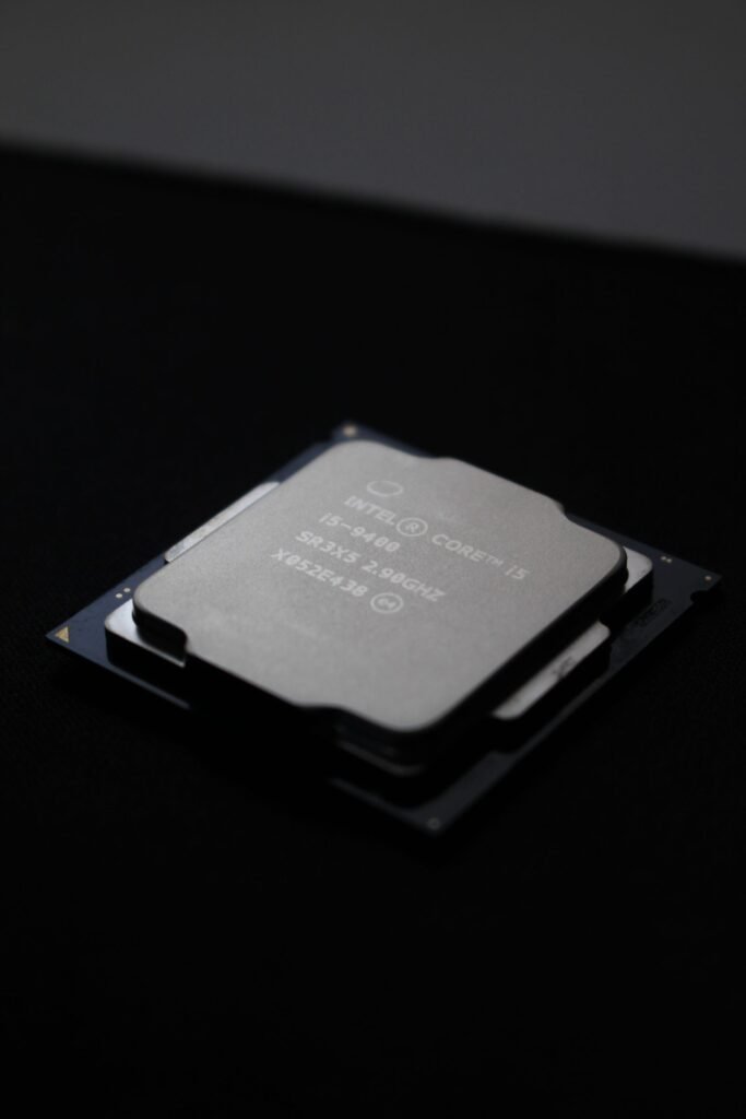 Close-up macro shot of a smartphone processor die, illustrating the Snapdragon 8 Elite Gen 6 flagship chip