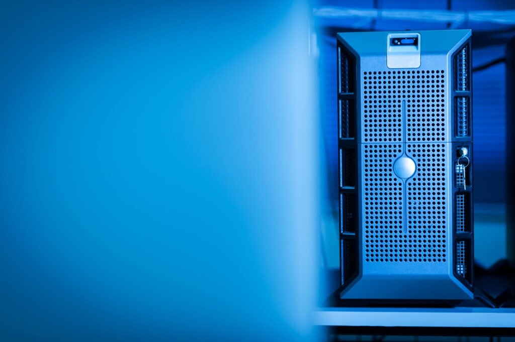 Rows of server hardware lit in blue inside a data center
