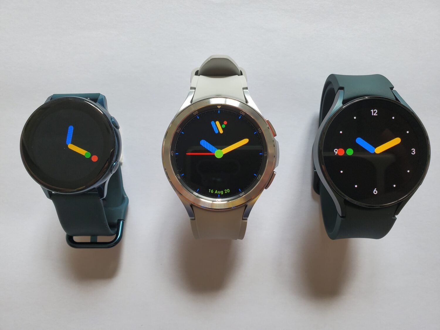 Close-up of modern smartwatches with metal and ceramic-style cases on display