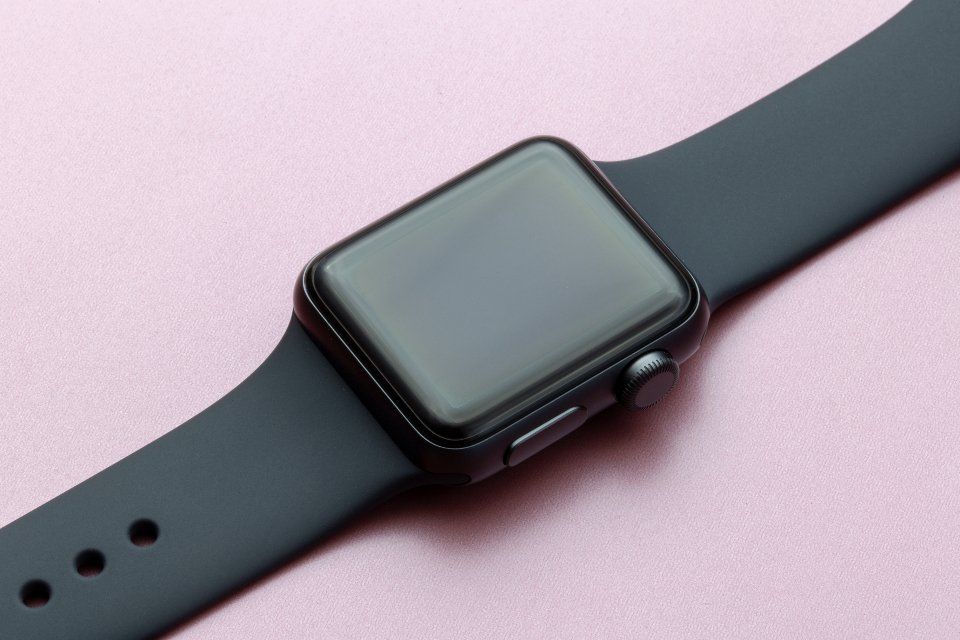 Macro close-up of a smartwatch with a digital crown, the style of watch that trades battery life for a bright always-on display