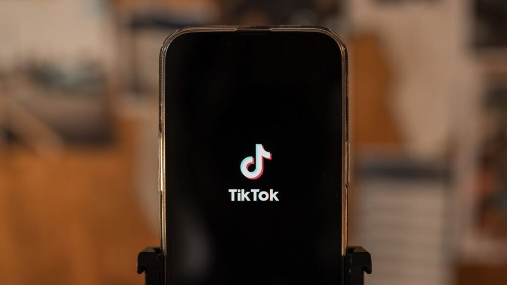 Smartphone on a tripod showing the TikTok app