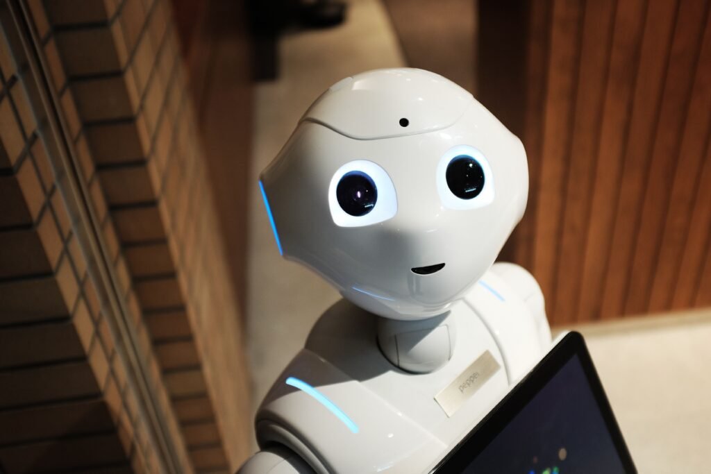 A humanoid robot photographed from a high angle in an indoor space