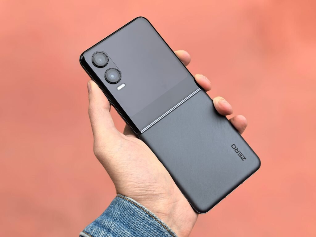 A person holding a modern folding smartphone, illustrating the iPhone Ultra MagSafe rumor