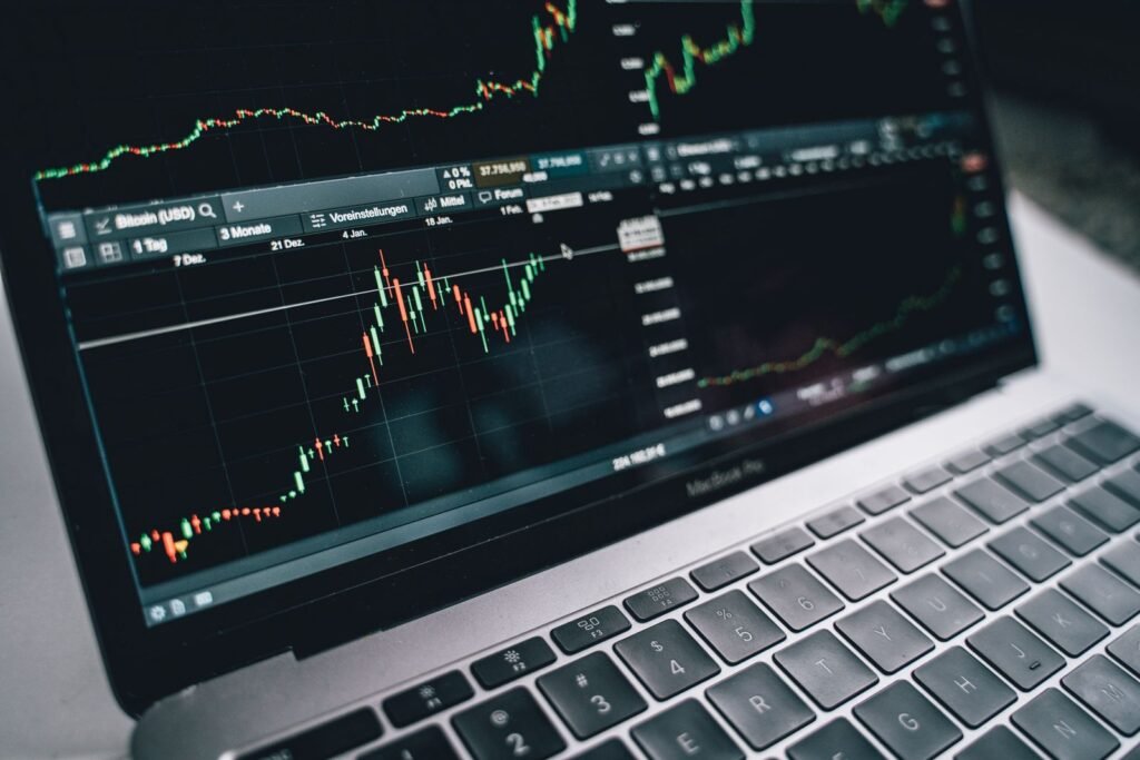 $1,000 in Microsoft Ten Years Ago Is Worth About $8,900 Today. The Hard Part Was Holding It. Laptop displaying a stock market price chart on a desk