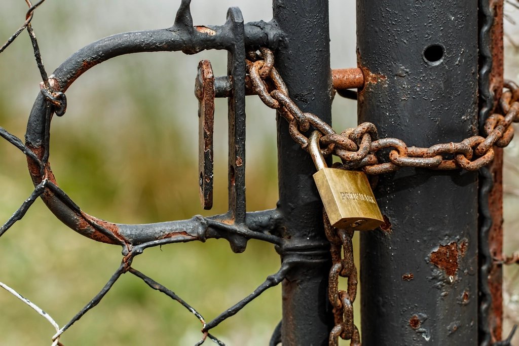 Nvidia Wants a Separate Chip to Guard AI Agents. The Sandbox Was Never the Problem, It Says. Stainless steel padlock locked on a chain, representing security around AI agents