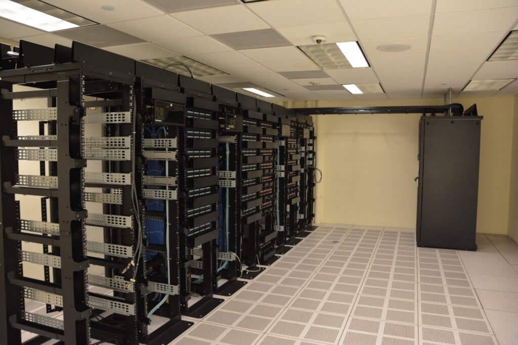 Rows of illuminated server racks in a data center