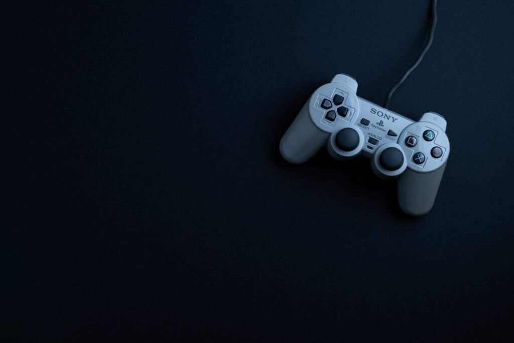 PlayStation DualSense controller in low light, symbolizing games losing online support