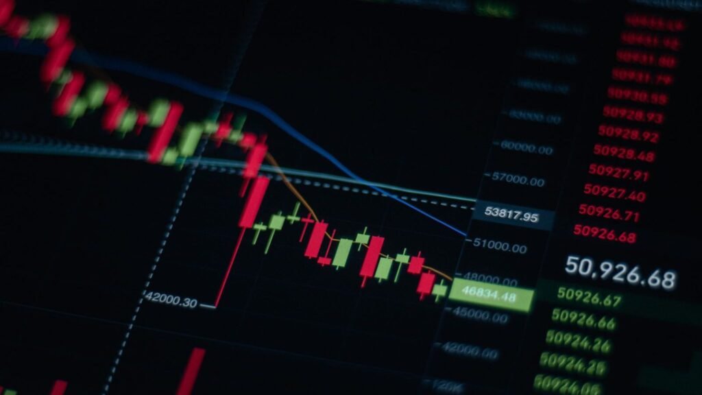 Business data graph on a monitor showing market trends