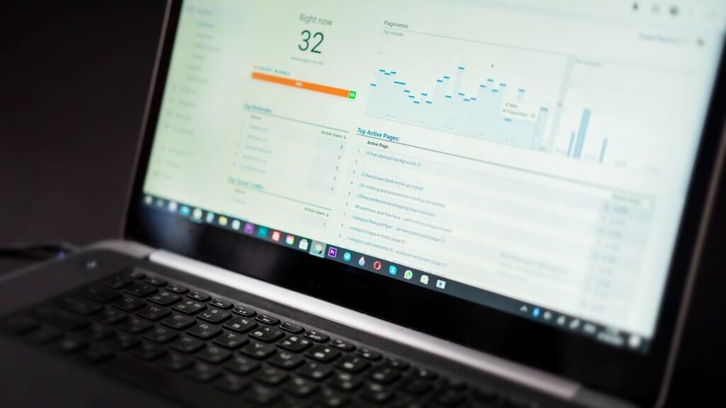 Where to Host Grafana: Cloud vs Self Hosted (2026) Laptop showing an analytics dashboard with real time data